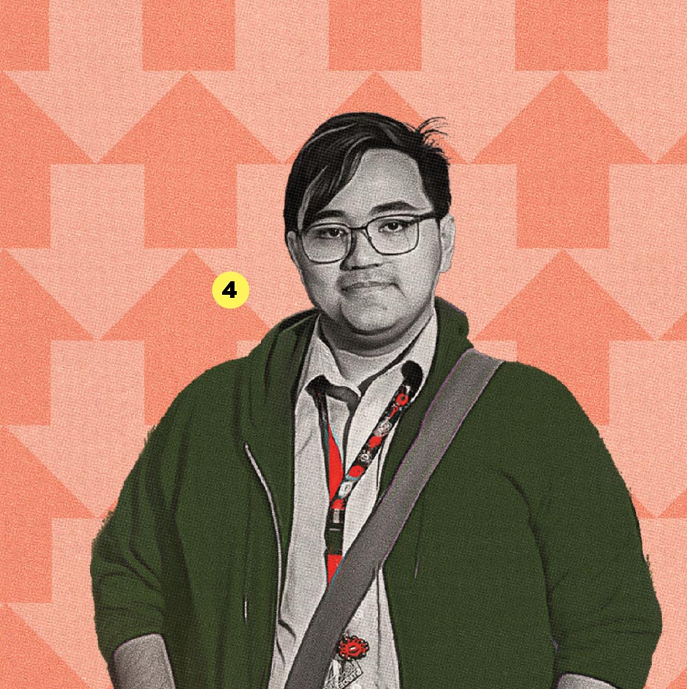 A young person with glasses, wearing a dark green cardigan and a lanyard, set against an orange background with arrows.