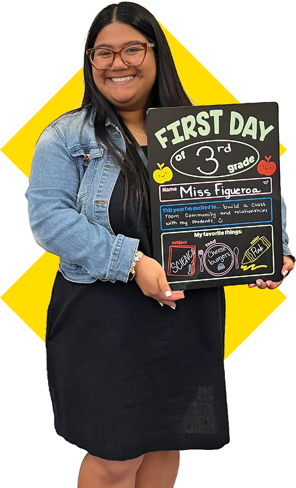 Ariana Figueroa holding a "First Day of 3rd Grade" sign for Miss Figueroa.